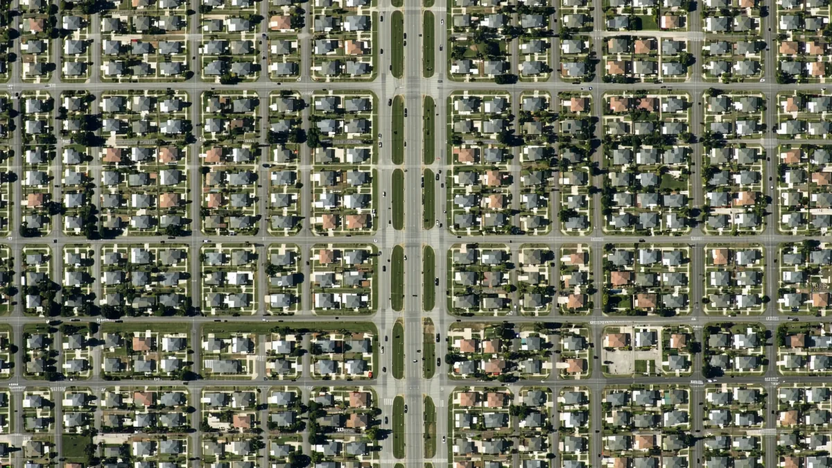 Aerial view of a sparse suburban delivery zone with low stop density visible