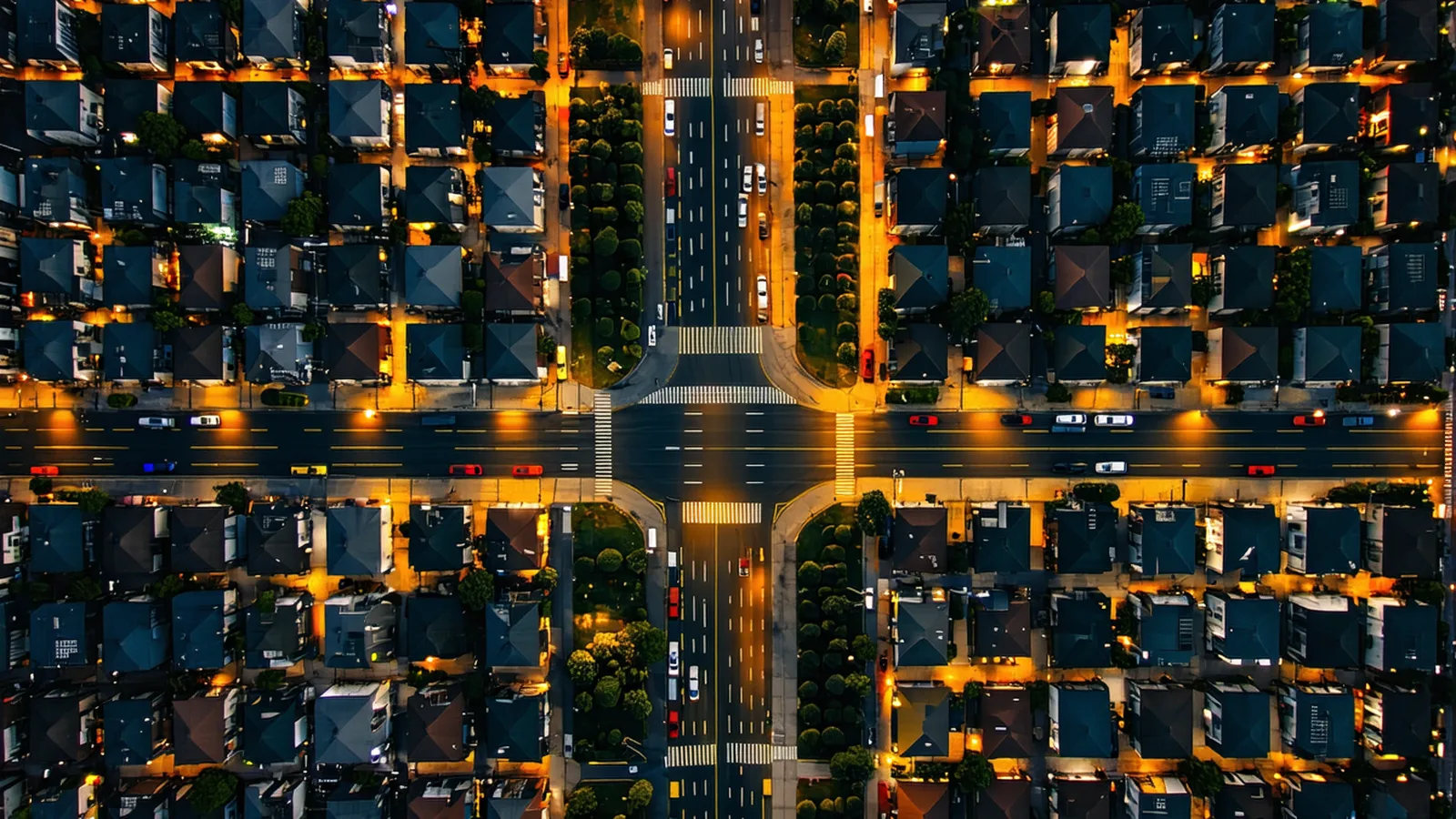 Aerial view of delivery routes overlaid on a city grid at dusk — amber route lines on dark urban map